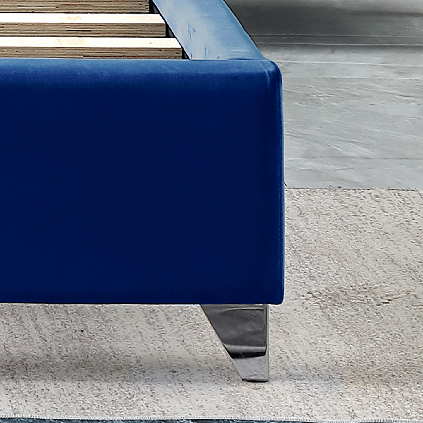 velvet upholstered bed with deep button tufting, blue