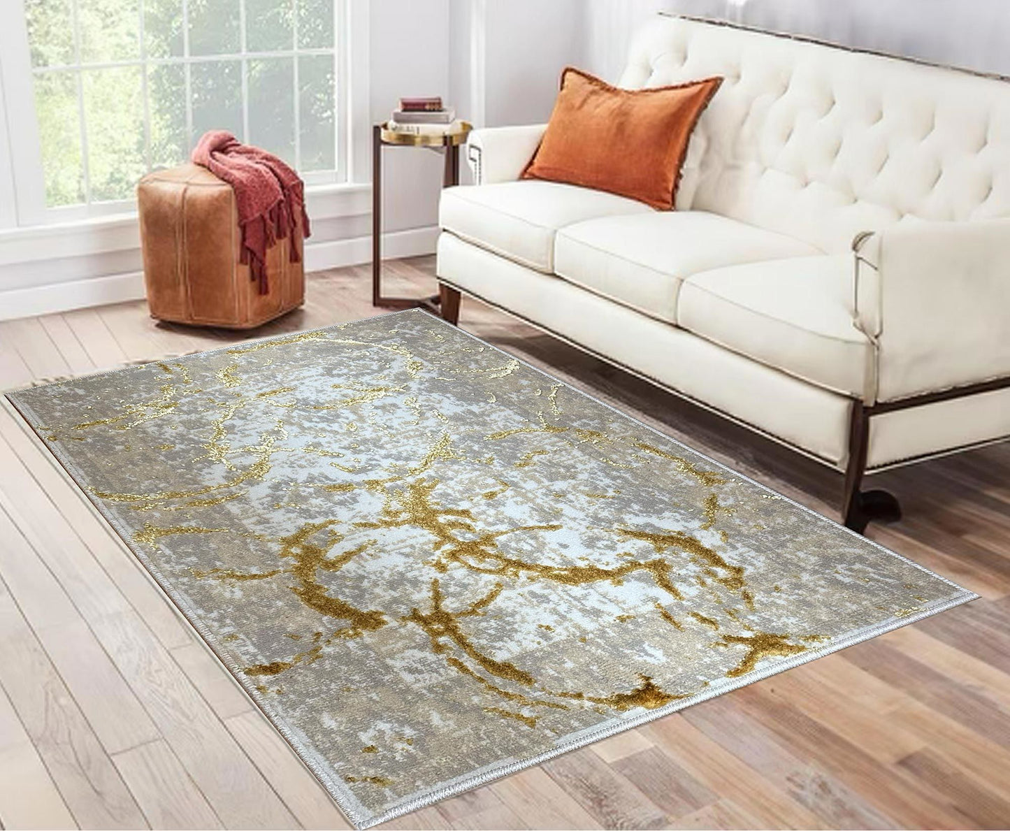 penina luxury area rug in beige and gray with gold circles abstract design