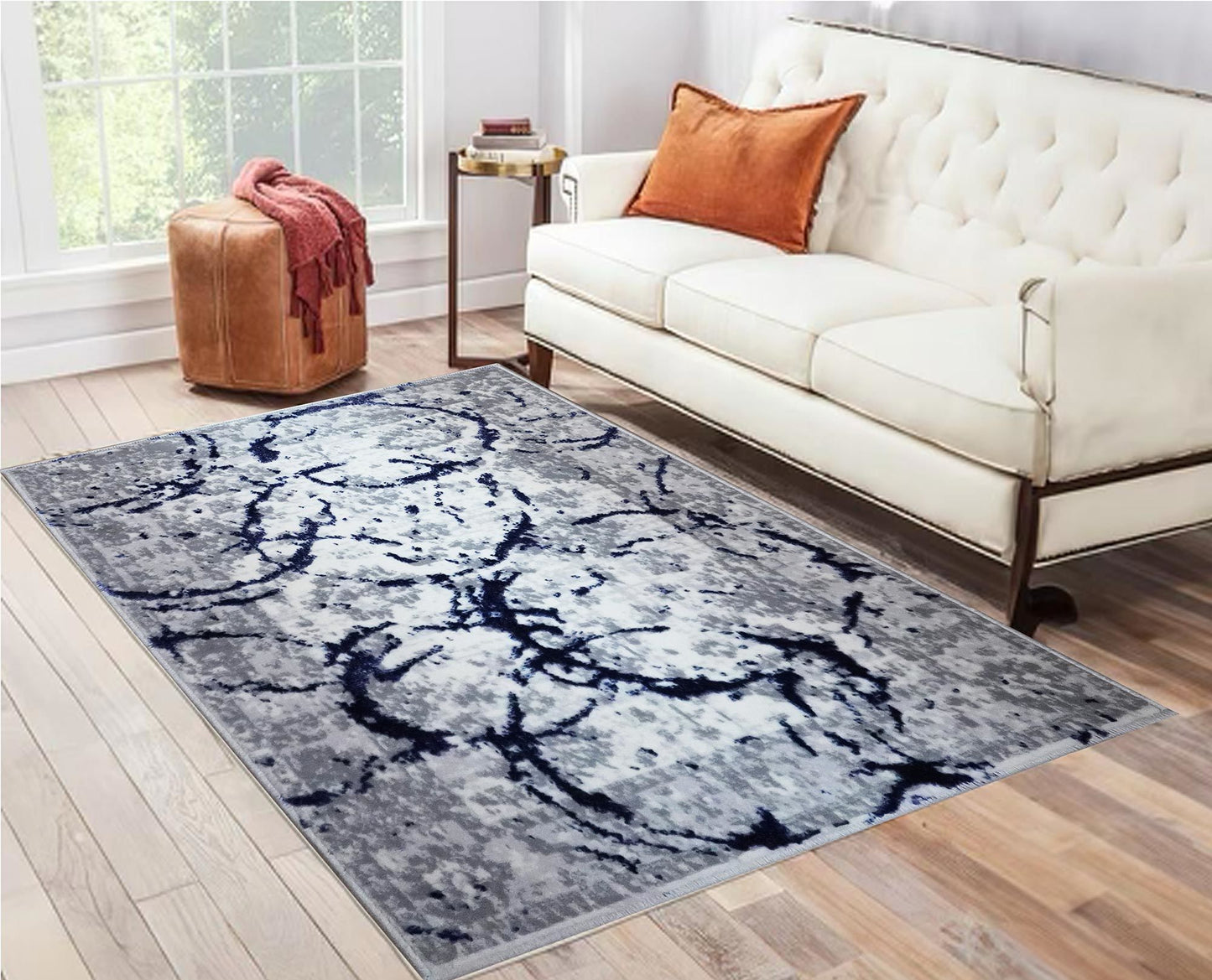penina luxury area rug in gray with navy blue circles abstract design