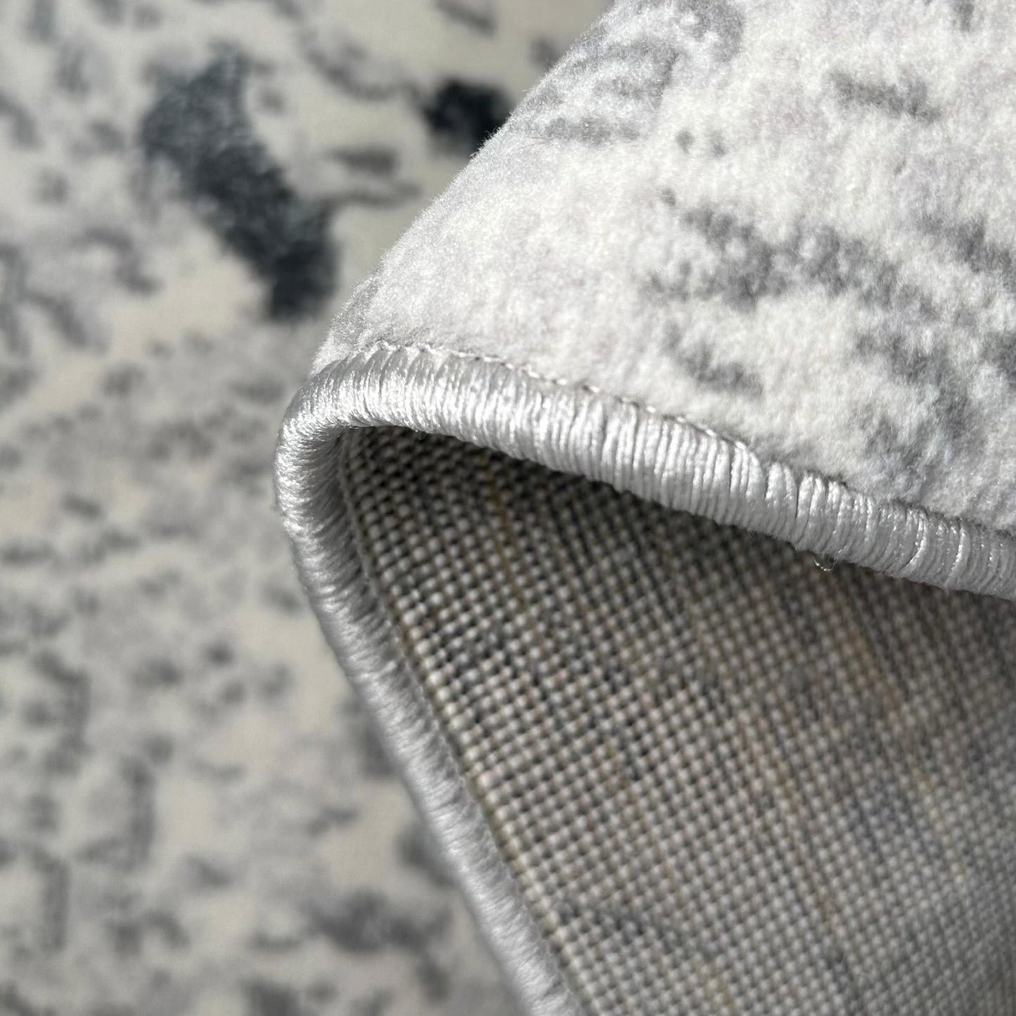 penina luxury area rug in gray with silver circles abstract design