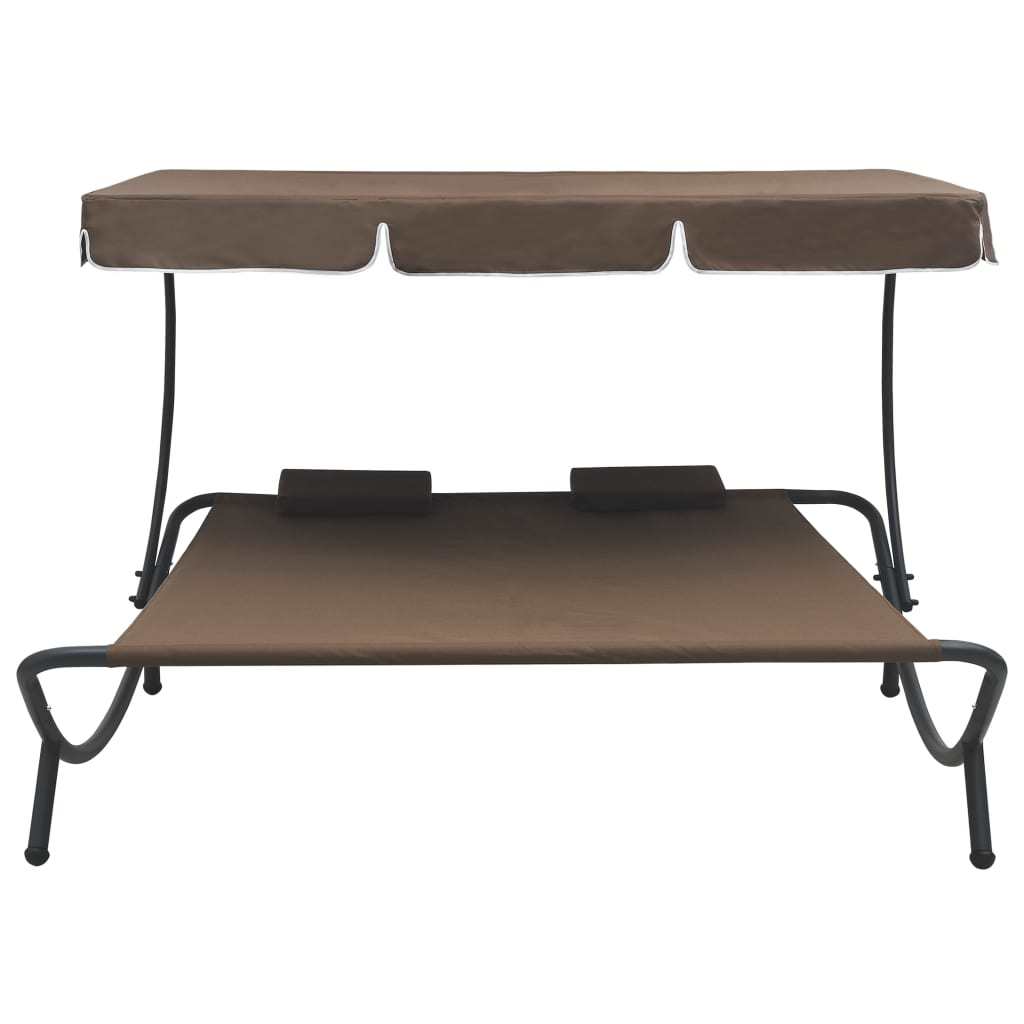 patio lounge bed with canopy and pillows brown