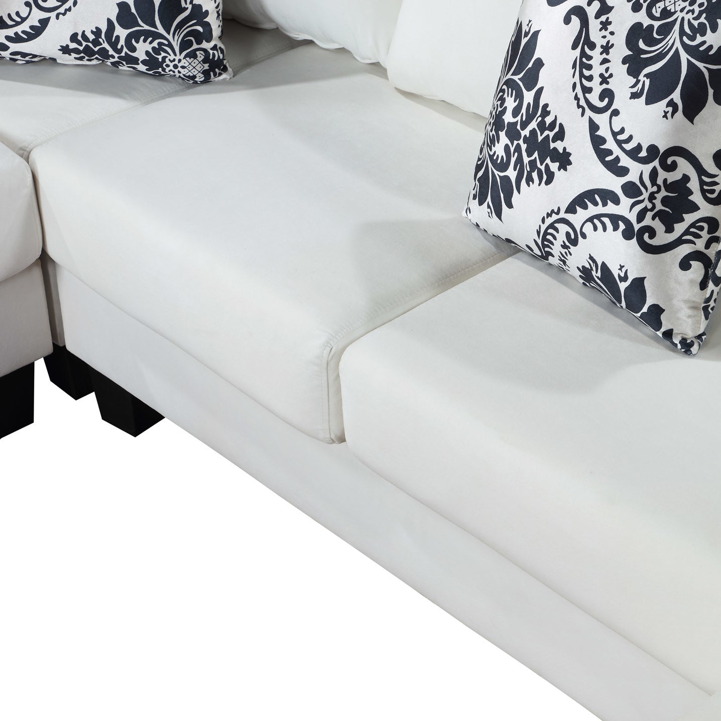elegant velvet corner couch with lots of pillows