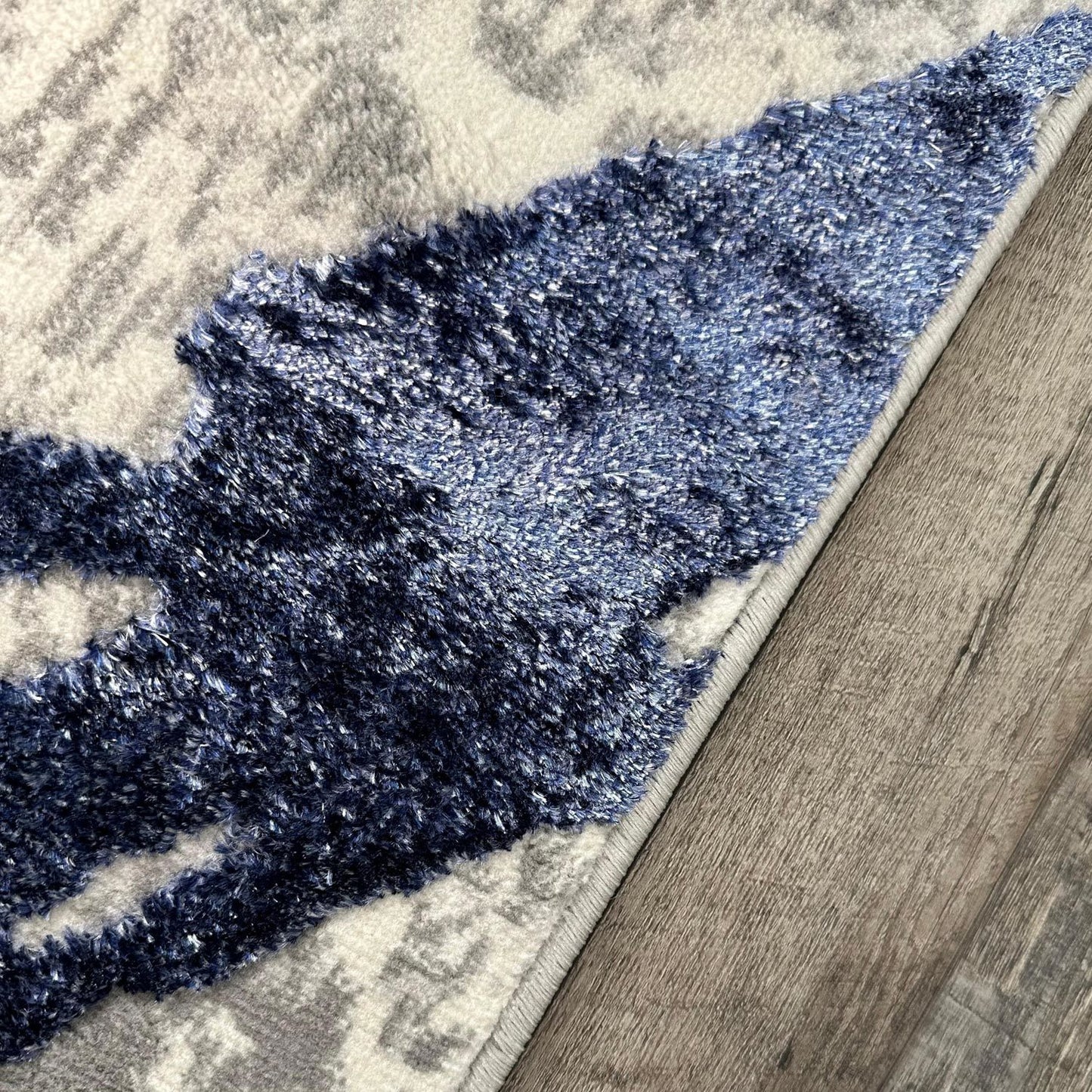 penina luxury area rug in gray with navy blue circles abstract design