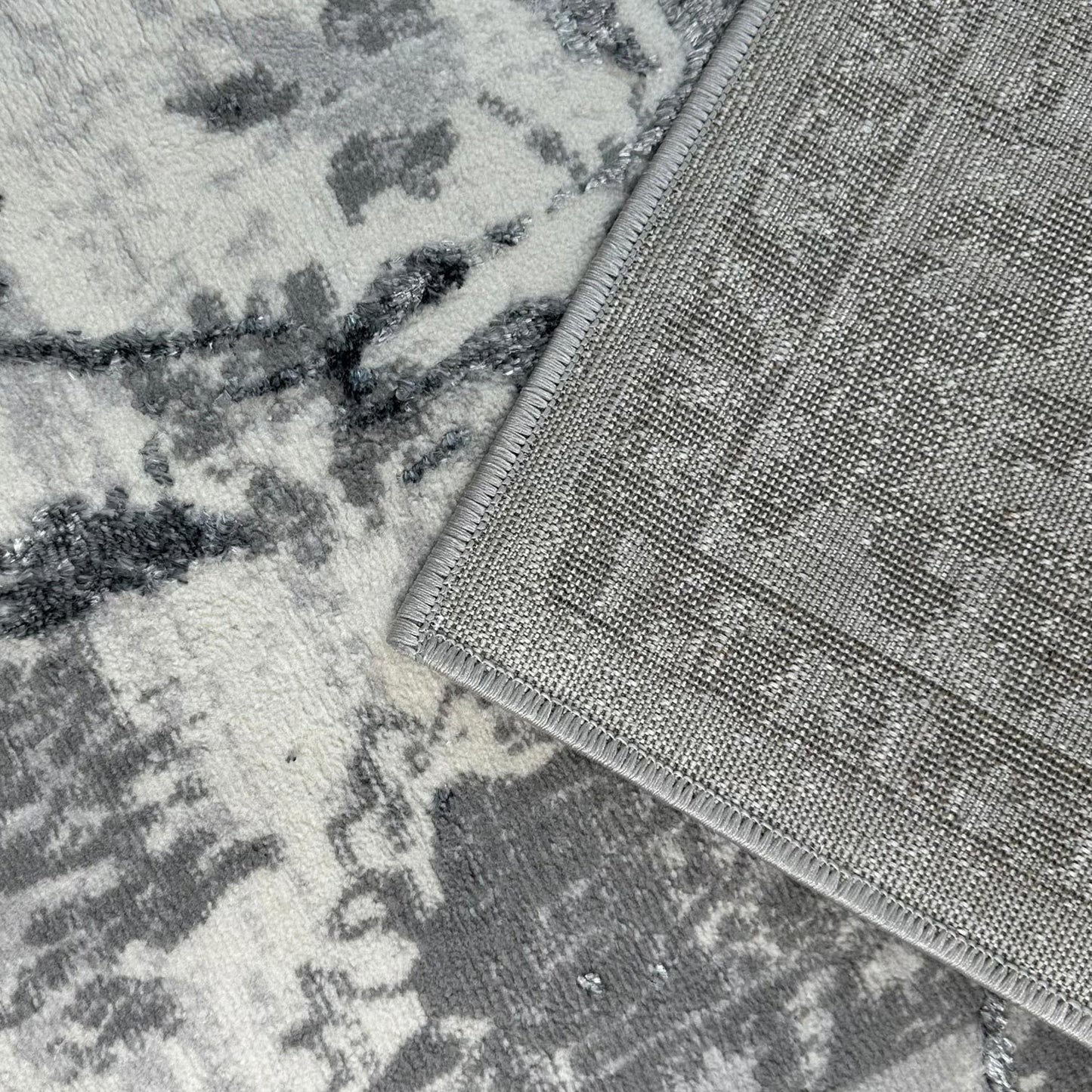 penina luxury area rug in gray with silver circles abstract design