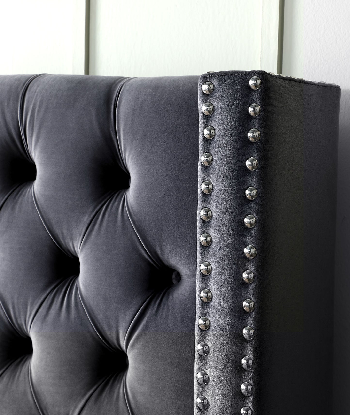 velvet upholstered bed with deep button tufting, grey
