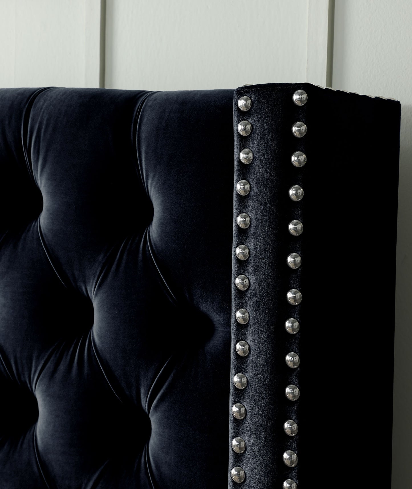 velvet upholstered bed with deep button tufting, black