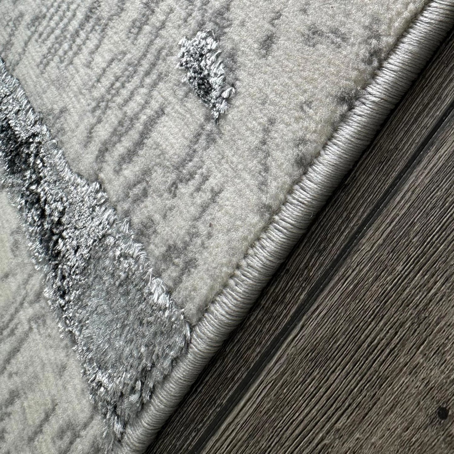 penina luxury area rug in gray with navy blue circles abstract design