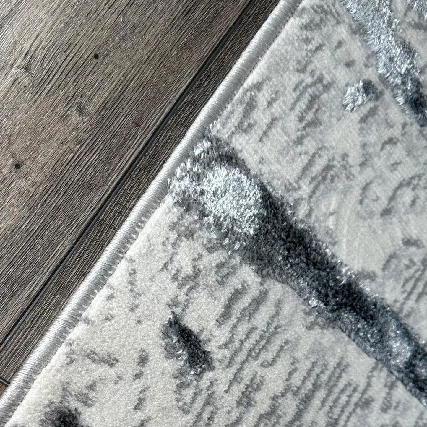 penina luxury area rug in gray with silver circles abstract design