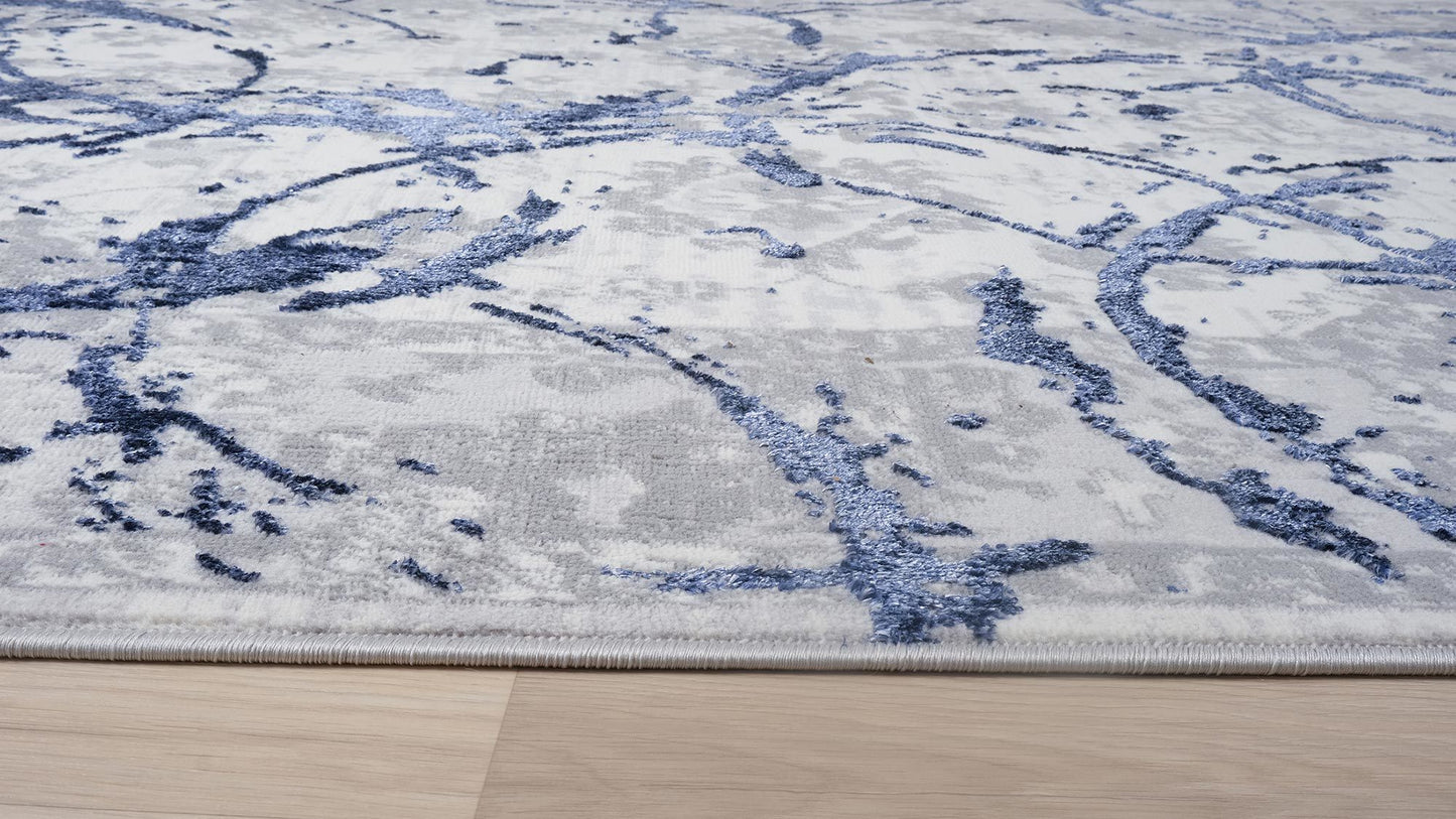 penina luxury area rug in gray with navy blue circles abstract design