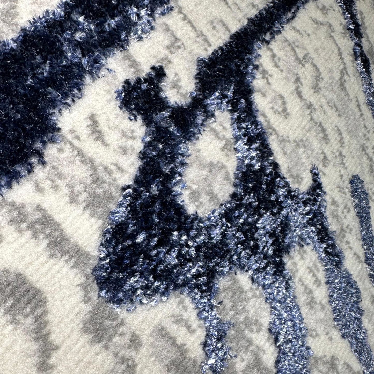 penina luxury area rug in gray with navy blue circles abstract design