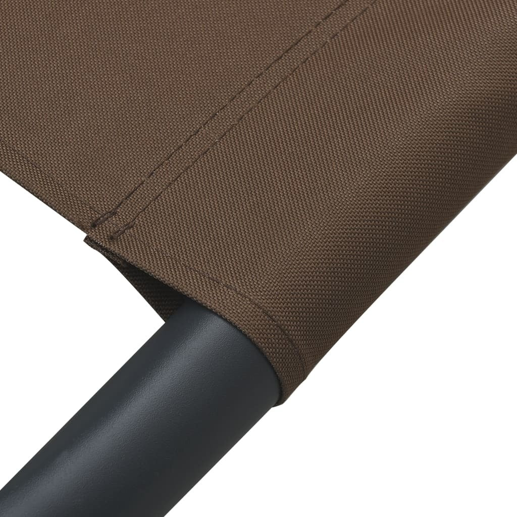 patio lounge bed with canopy and pillows brown