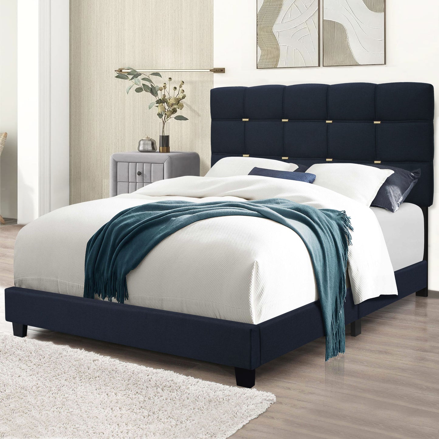 elegant upholstered bed frame with gold accents on headboard