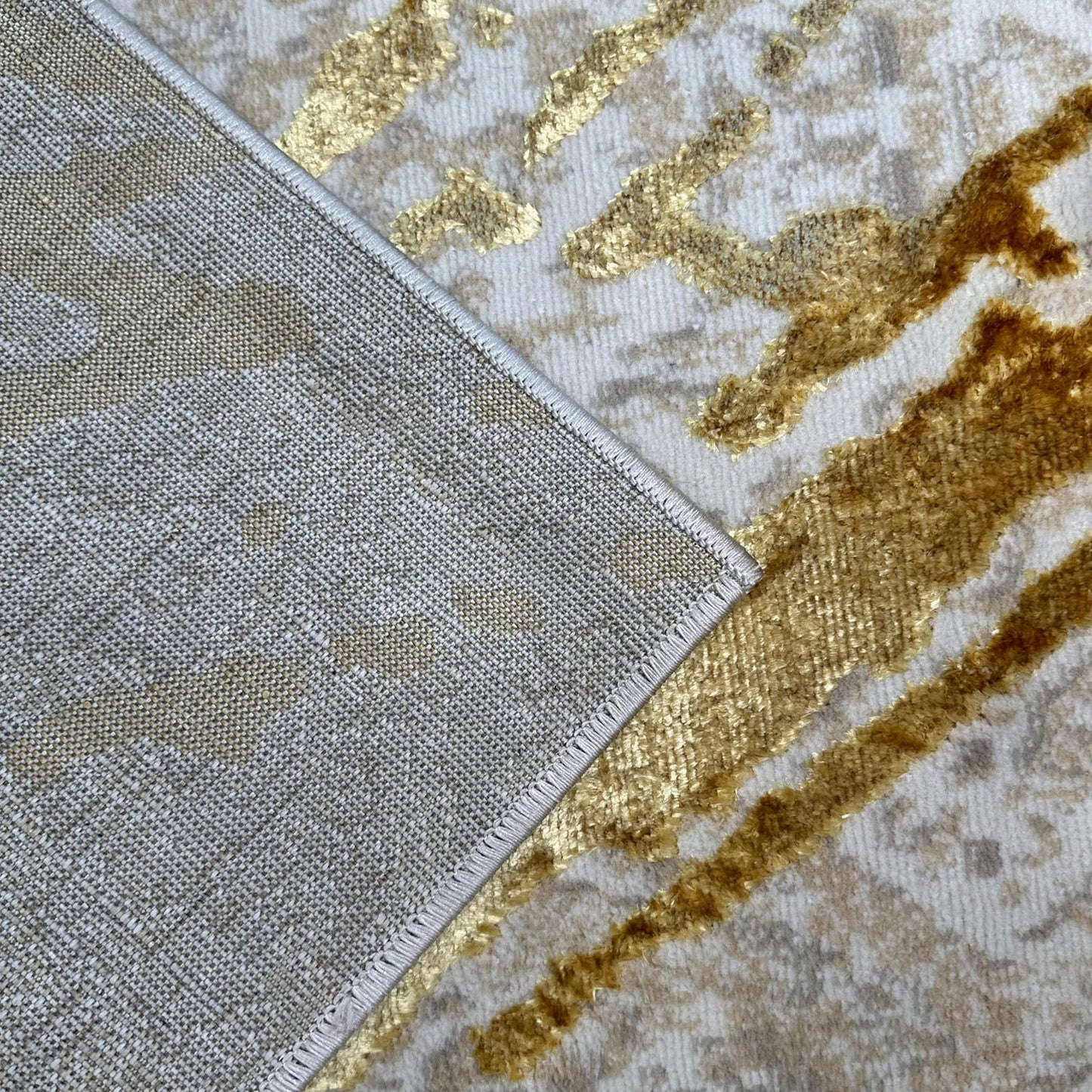shifra luxury area rug in beige and gray with gold abstract design
