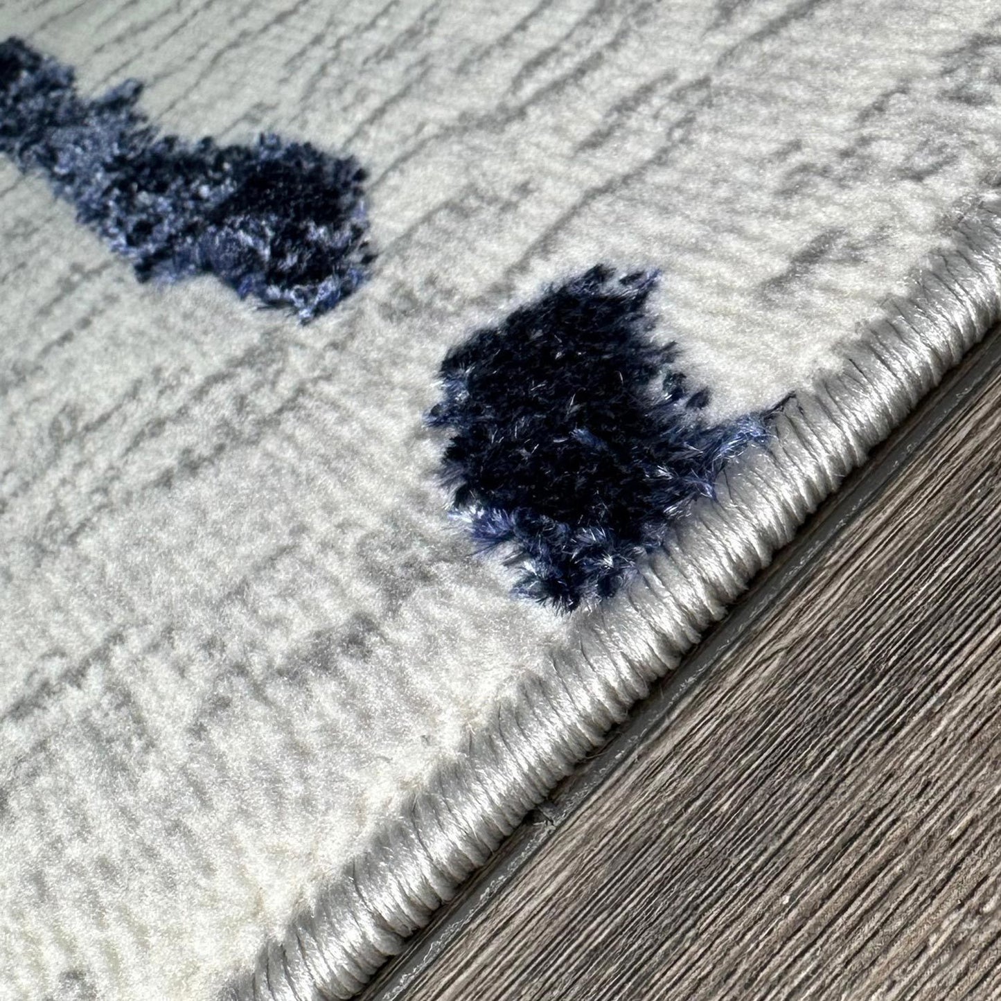 penina luxury area rug in gray with navy blue circles abstract design