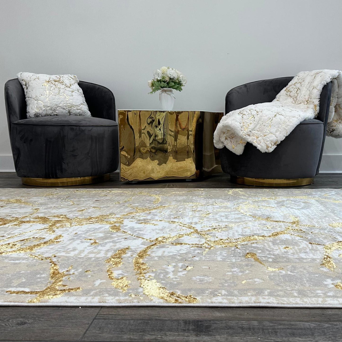 penina luxury area rug in beige and gray with gold circles abstract design